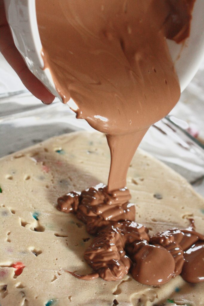 Pouring chocolate on my cookie dough bar recipe. 
