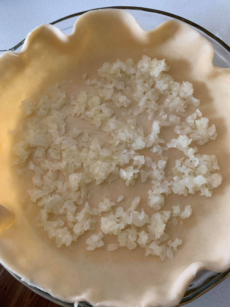 onions and butter in breakfast quiche crust