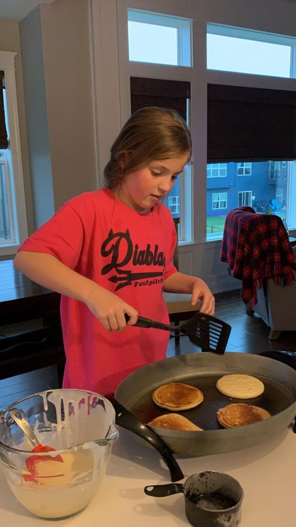 kids baking in the kitchen making homemade pancakes